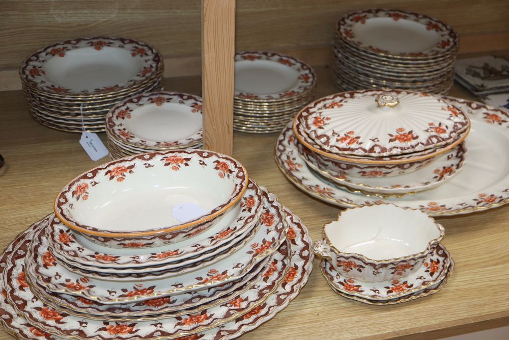 A Victorian Copeland part dinner service, transfer-printed with peonies and foliage in orange and brown,